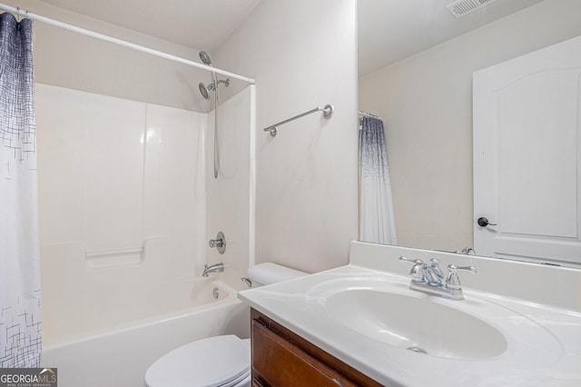 full bathroom featuring vanity, shower / tub combo, and toilet