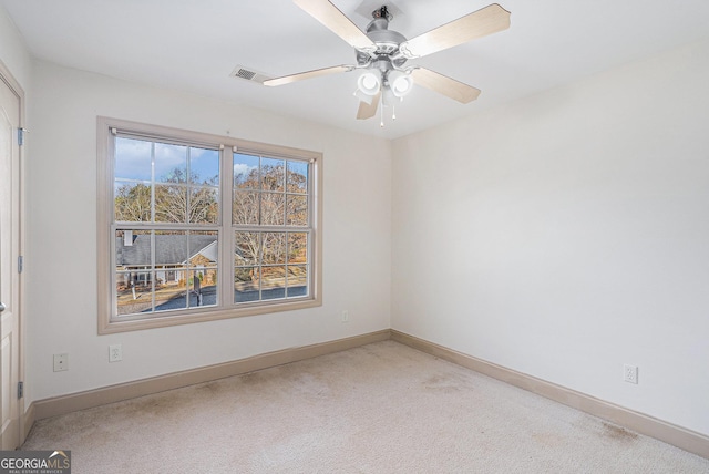 carpeted empty room with ceiling fan