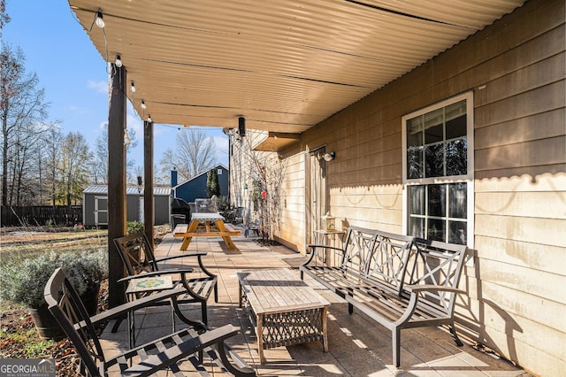 view of patio / terrace featuring a shed