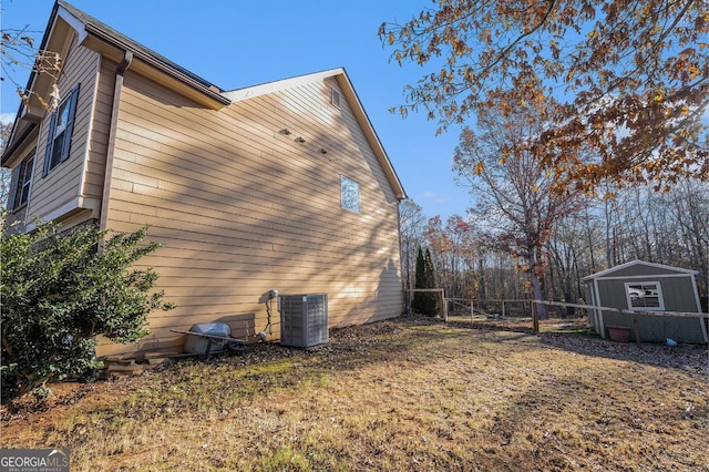 view of home's exterior featuring a storage shed and central air condition unit