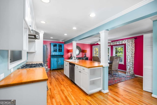 kitchen with ceiling fan, light hardwood / wood-style flooring, white cabinets, and appliances with stainless steel finishes