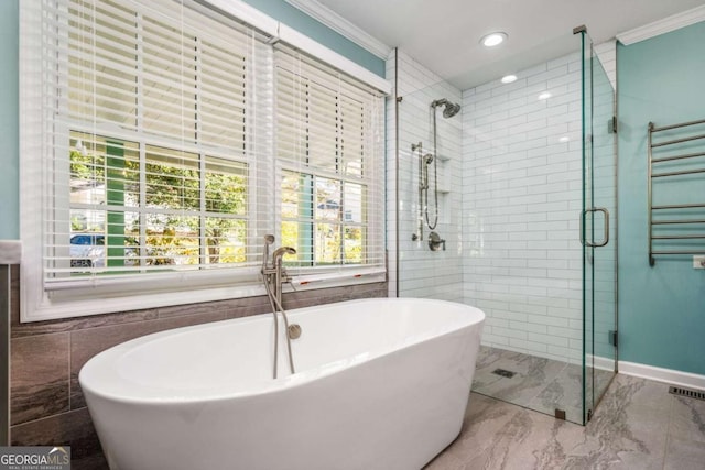 bathroom with crown molding, radiator heating unit, tile walls, and shower with separate bathtub