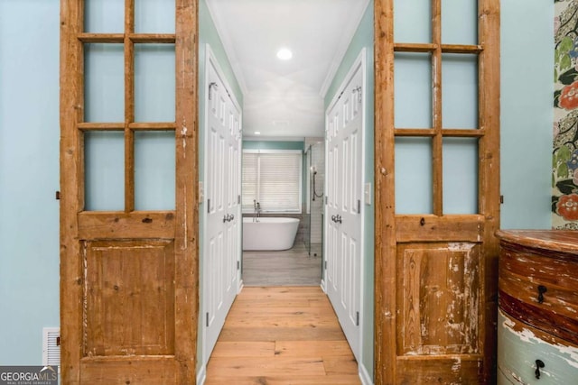 hall with light wood-type flooring