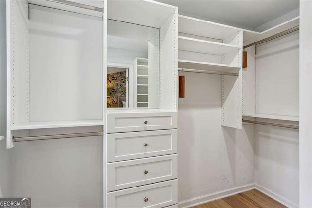 walk in closet featuring light hardwood / wood-style floors