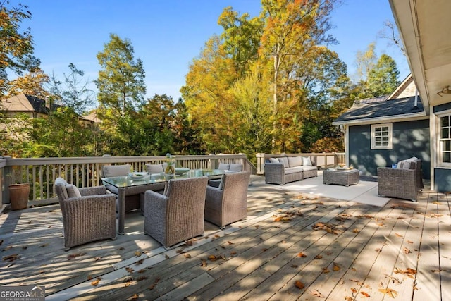 wooden terrace featuring an outdoor living space