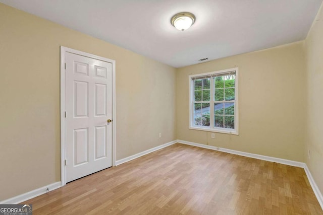 unfurnished room with light hardwood / wood-style flooring