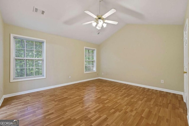 unfurnished room featuring ceiling fan, light hardwood / wood-style floors, and lofted ceiling