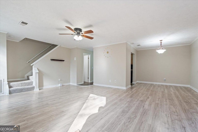 unfurnished living room featuring a textured ceiling, ceiling fan, crown molding, and light hardwood / wood-style flooring