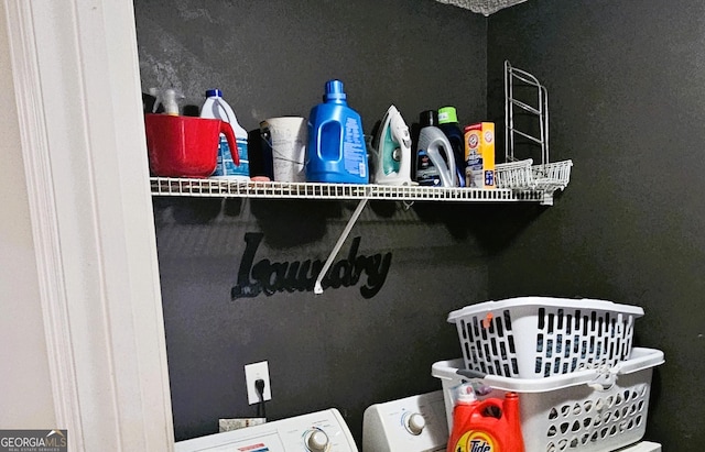 pantry featuring washer and dryer