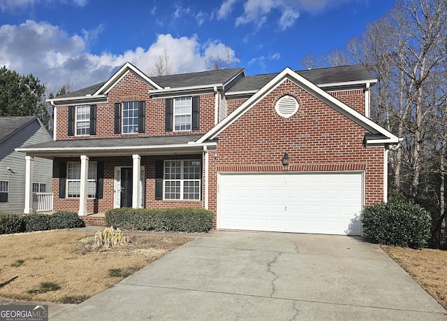 view of front of home featuring a porch and a garage