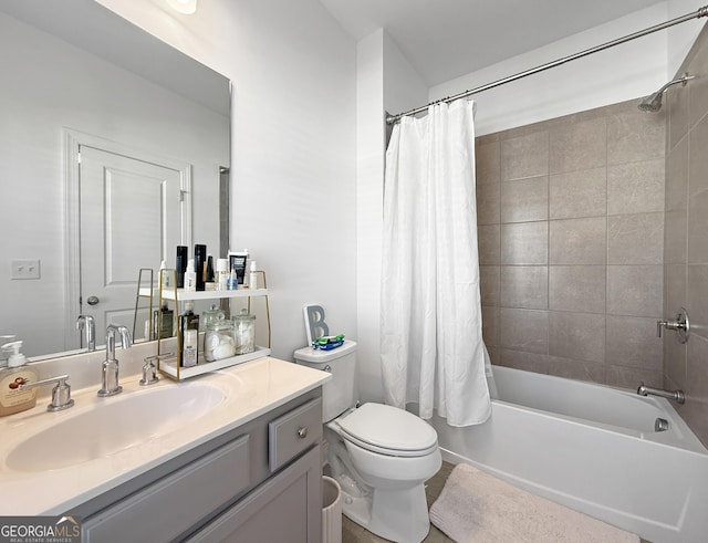 full bathroom with shower / bath combo, vanity, and toilet