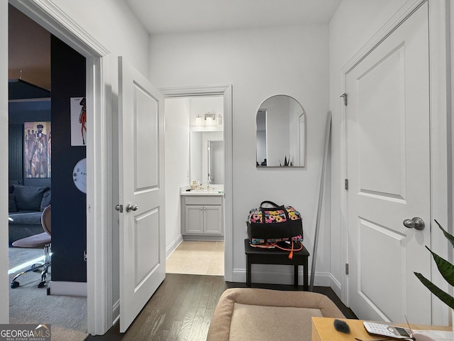 hallway with dark hardwood / wood-style flooring