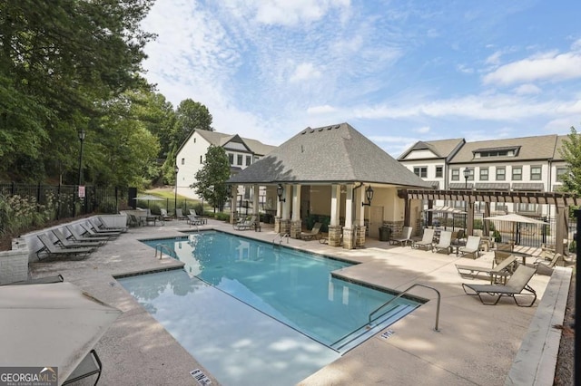 view of swimming pool with a patio