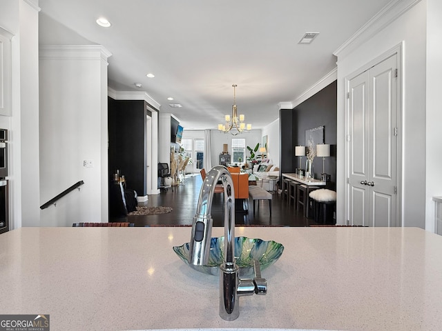 dining space with a notable chandelier and ornamental molding