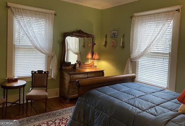 bedroom with wood-type flooring and crown molding