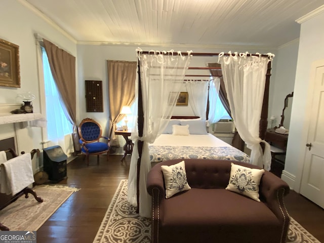 bedroom with crown molding, cooling unit, and dark wood-type flooring