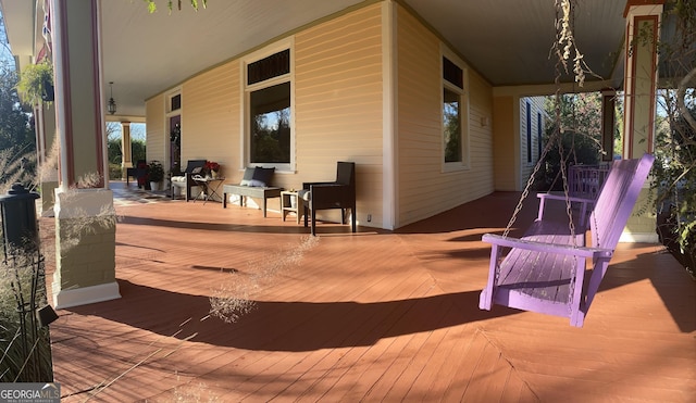 wooden deck featuring covered porch