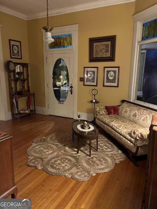 interior space with crown molding and hardwood / wood-style flooring