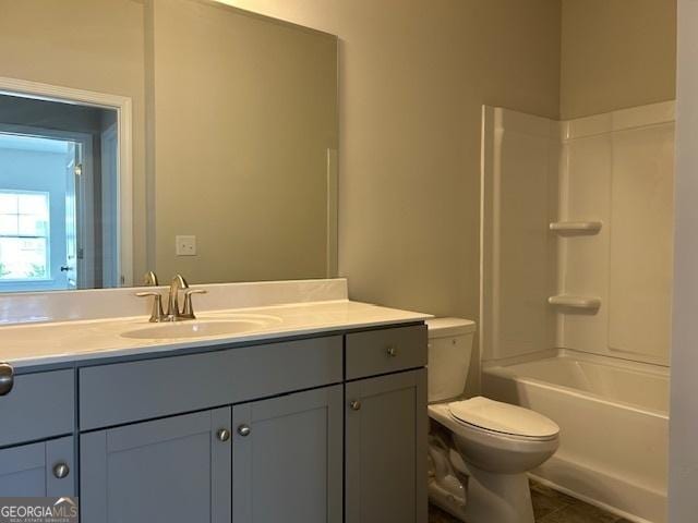 full bathroom with vanity, bathtub / shower combination, and toilet