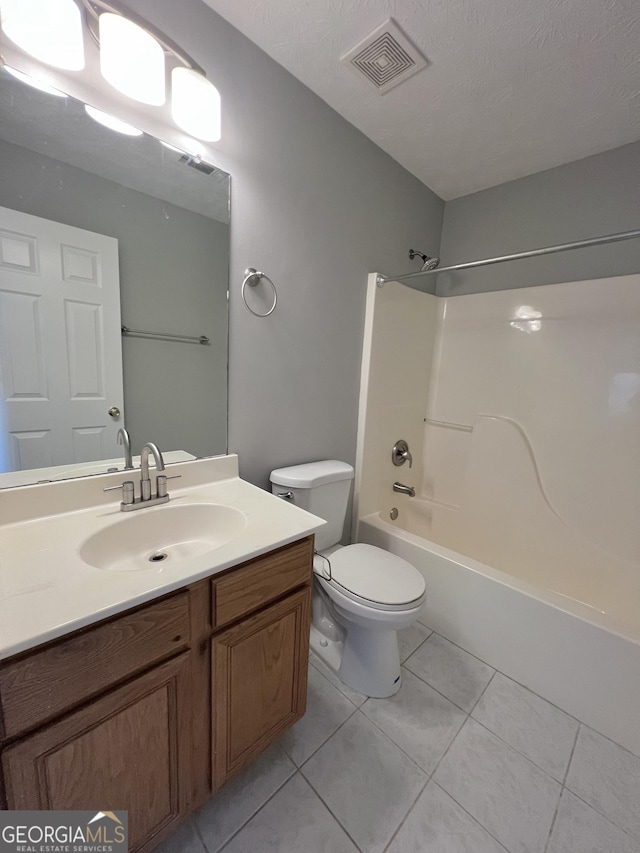 full bathroom featuring toilet, a textured ceiling, tile patterned floors, and  shower combination