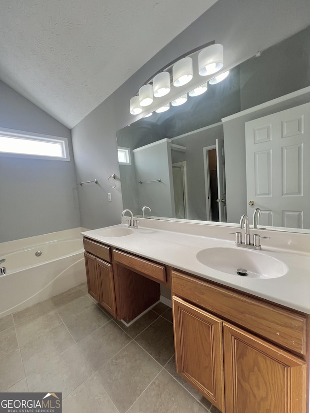 bathroom with tile patterned floors, a textured ceiling, lofted ceiling, vanity, and shower with separate bathtub