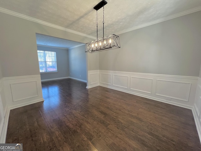 unfurnished dining area featuring crown molding, dark wood-type flooring, and a textured ceiling