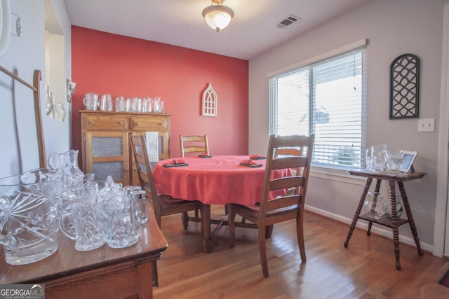 dining room with hardwood / wood-style floors