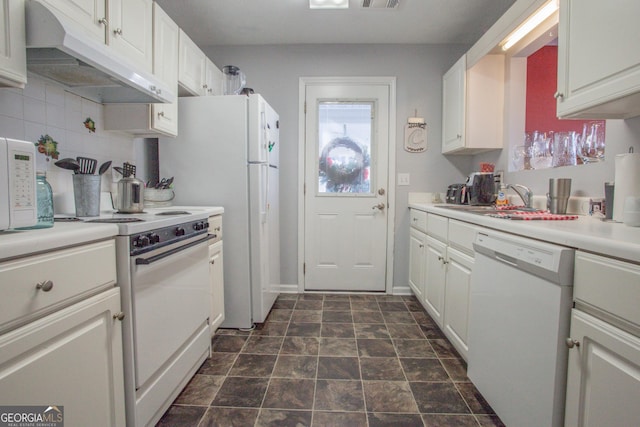 kitchen featuring white appliances, tasteful backsplash, white cabinetry, and sink