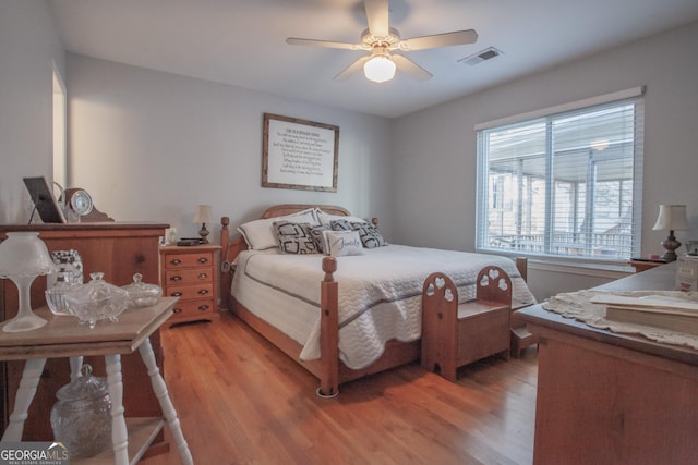 bedroom featuring light hardwood / wood-style floors and ceiling fan