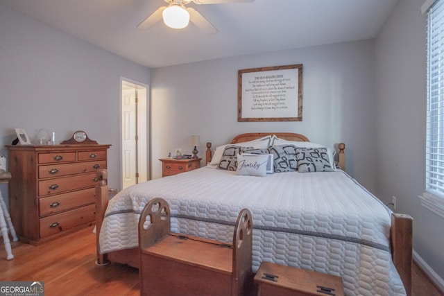 bedroom featuring ceiling fan and light hardwood / wood-style flooring