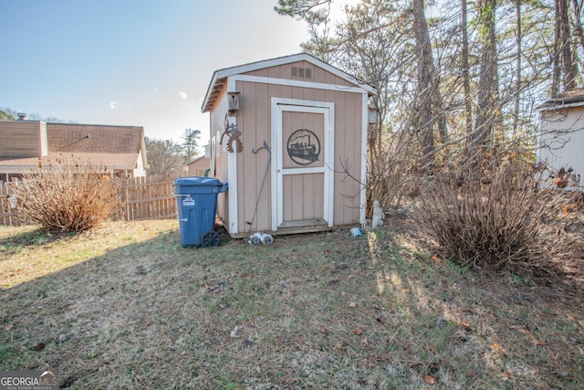 view of outbuilding featuring a yard