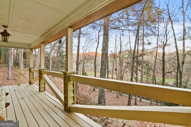 wooden terrace featuring covered porch