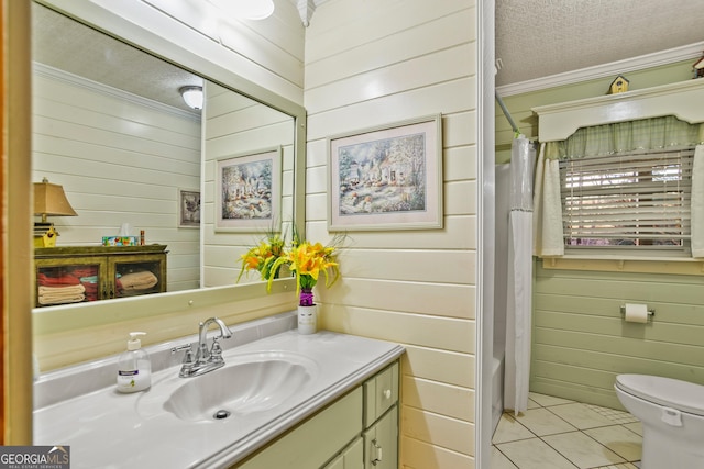 full bathroom featuring tile patterned floors, crown molding, wooden walls, and a textured ceiling