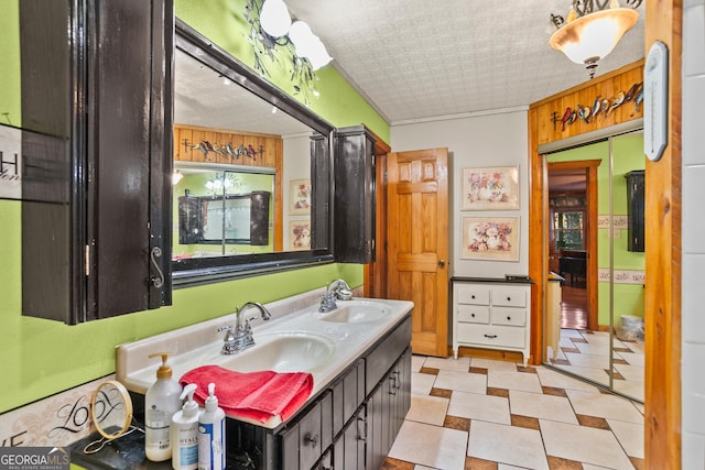 bathroom featuring vanity and ornamental molding