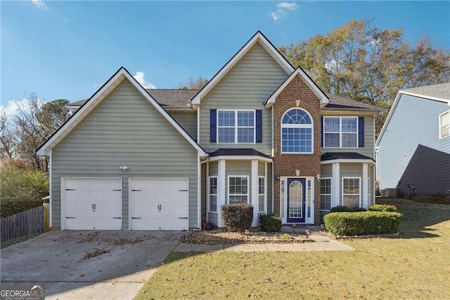 front of property with a front lawn and a garage