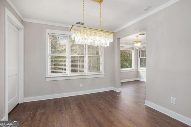 unfurnished dining area featuring ornamental molding, dark wood-type flooring, and a notable chandelier