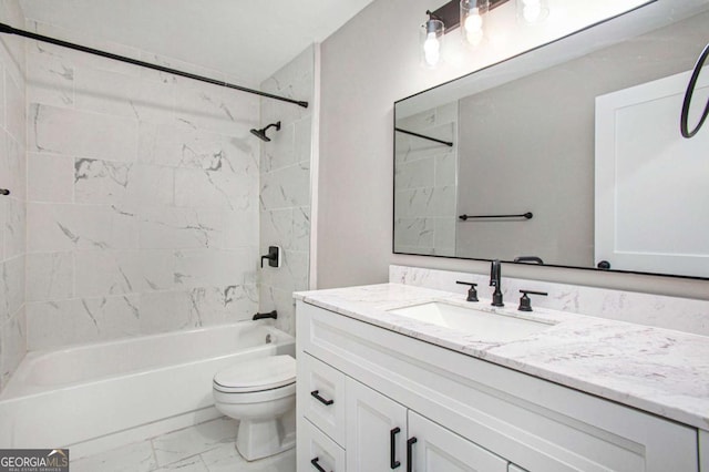 full bathroom featuring vanity, tiled shower / bath combo, and toilet