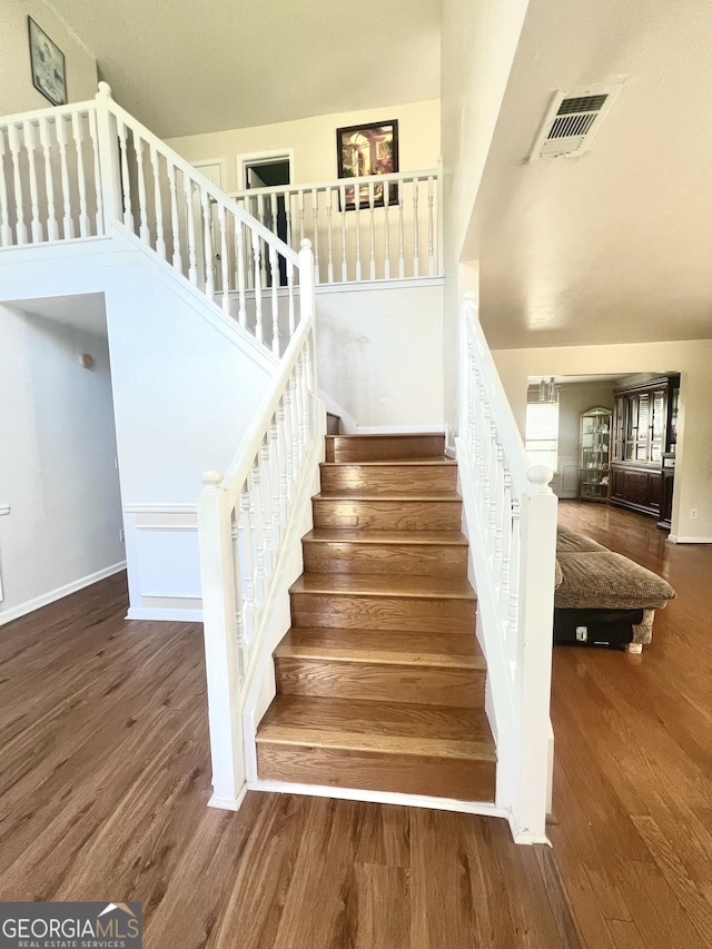 stairs with wood-type flooring