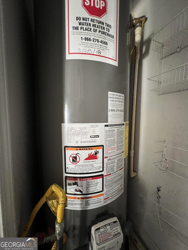 utility room with water heater