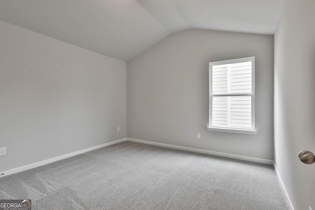 bonus room featuring lofted ceiling and carpet