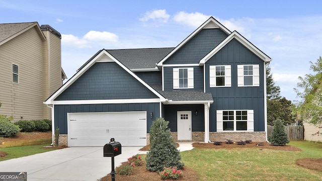 craftsman house featuring a garage and a front yard