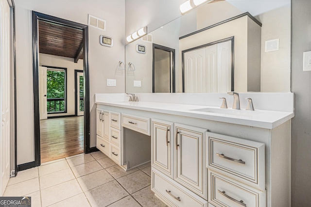 bathroom with hardwood / wood-style floors, vanity, and wooden ceiling