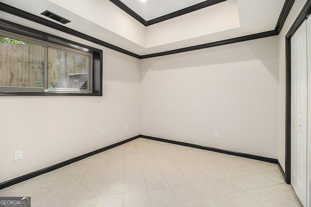 unfurnished room featuring crown molding