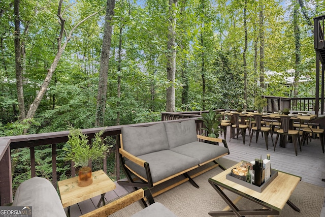 wooden terrace featuring an outdoor hangout area