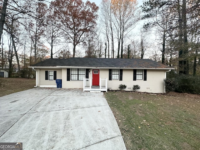 ranch-style house with a front lawn