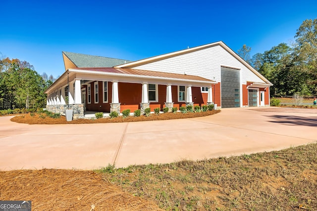 242 Kirkley Rd, Tyrone, GA 30290 - view of home's exterior with covered porch and a garage