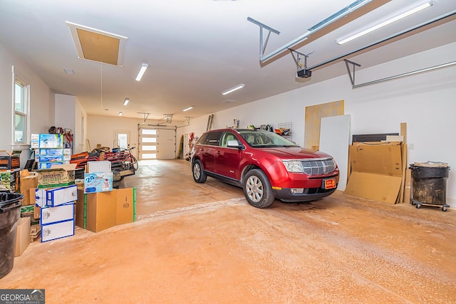 242 Kirkley Rd, Tyrone, GA 30290 - garage featuring a garage door opener