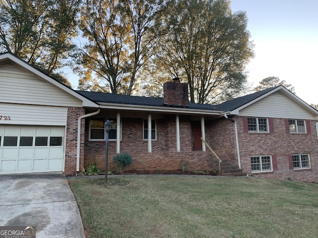 view of front facade with a front yard and a garage