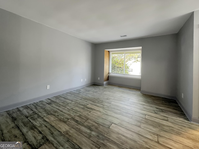 unfurnished room featuring light wood-type flooring