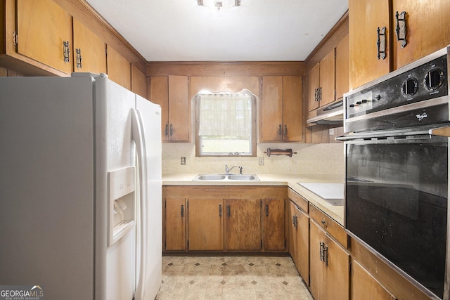 1228 Old Rockmart Rd SE, Silver Creek, GA 30173 - kitchen featuring white refrigerator with ice dispenser, oven, brown cabinetry, and a sink
